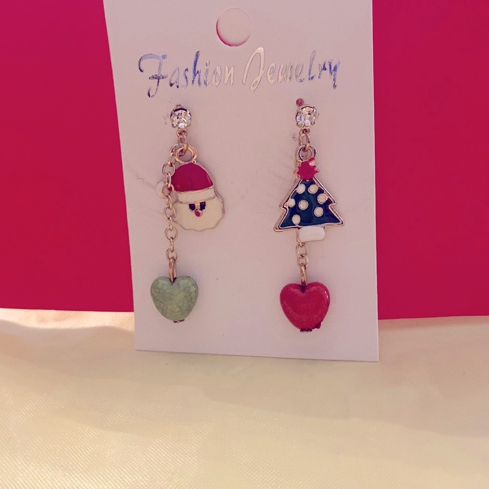 Christmas Dangle Earrings with Santa and tree with hearts hanging from.